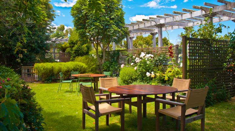 dining-table-set-in-lush-garden-000050254596_Large.jpg