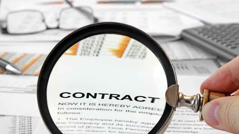 Magnifying-Glass-Over-Contract-Papers-000028250286_Large.jpg