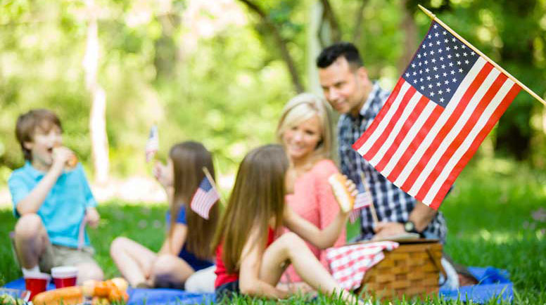 Family-enjoys-July-4th-picnic-in-summer-season.jpg