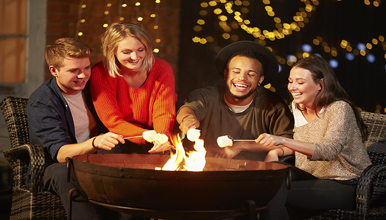 Group-Of-Friends-Toasting-Marshmallows-By-Firepit-resized.jpg
