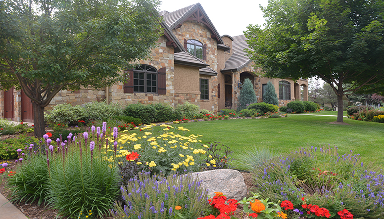 nice house with pretty lawn and landscape Credit Timberline Landscaping,.JPG